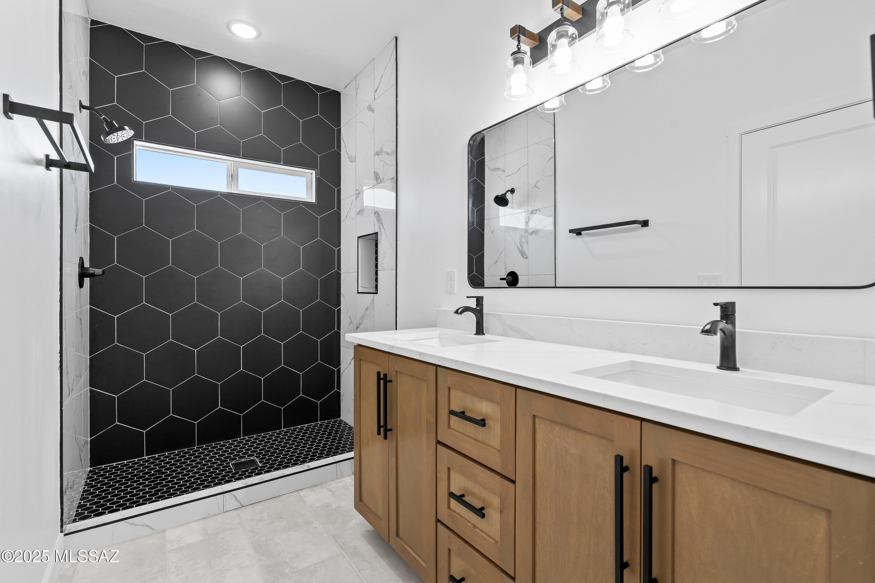 1667 Ave Calamar Rio Rico, AZ 85648 - Photo 19 of 33 a bathroom with a double vanity sink mirror and double