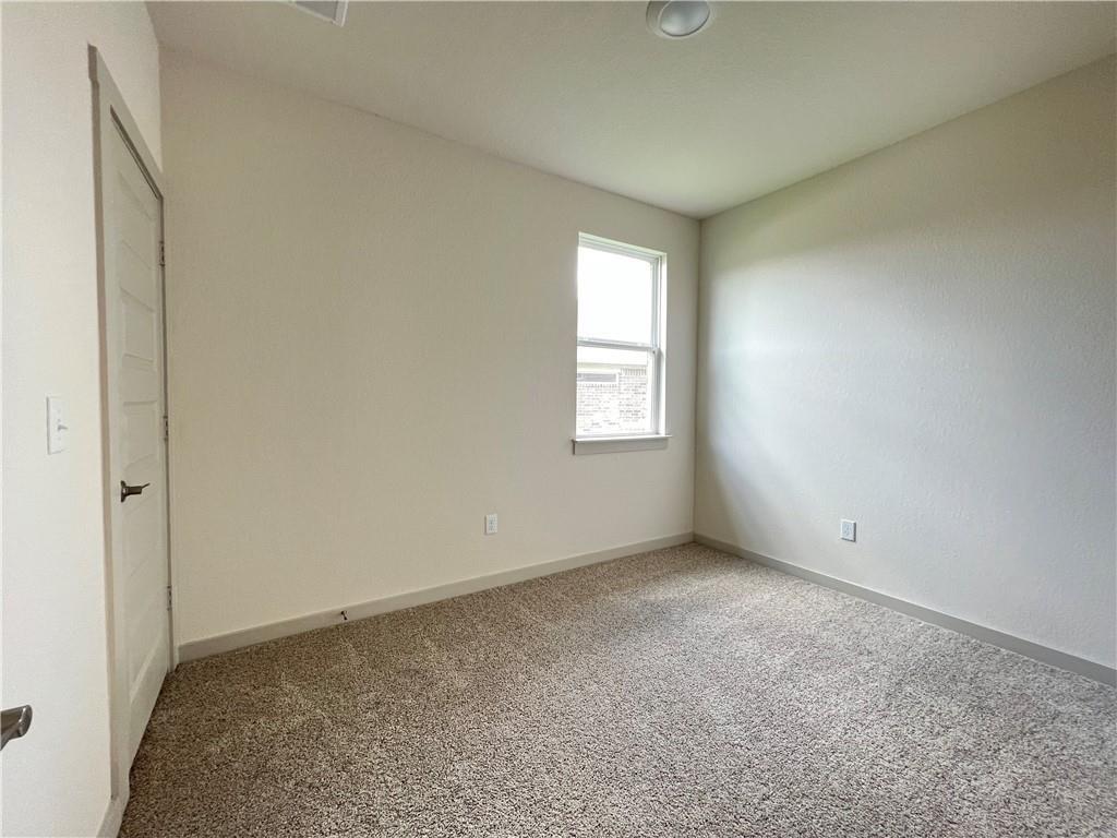 10600 Defender Trail Austin, TX 78754 - Photo 16 of 21 Unfurnished bedroom with carpet flooring and baseboards
