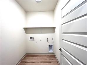 10600 Defender Trail Austin, TX 78754 - Photo 18 of 21 Laundry area featuring gas dryer hookup, electric dryer hookup, washer hookup, and light wood-type flooring