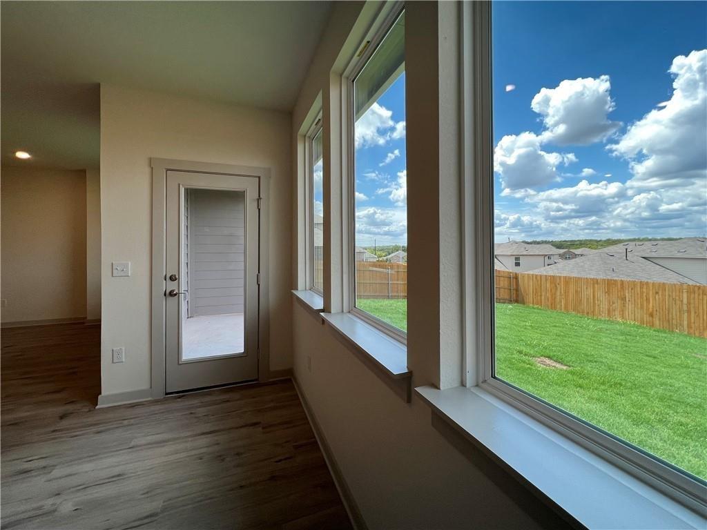 10600 Defender Trail Austin, TX 78754 - Photo 3 of 21 Doorway with wood finished floors and baseboards