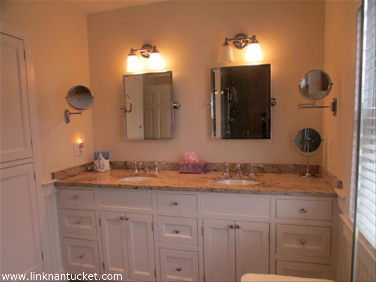 73 Fairgrounds Road Nantucket, MA 02554 - Photo 11 of 15 a bathroom with a sink and a mirror