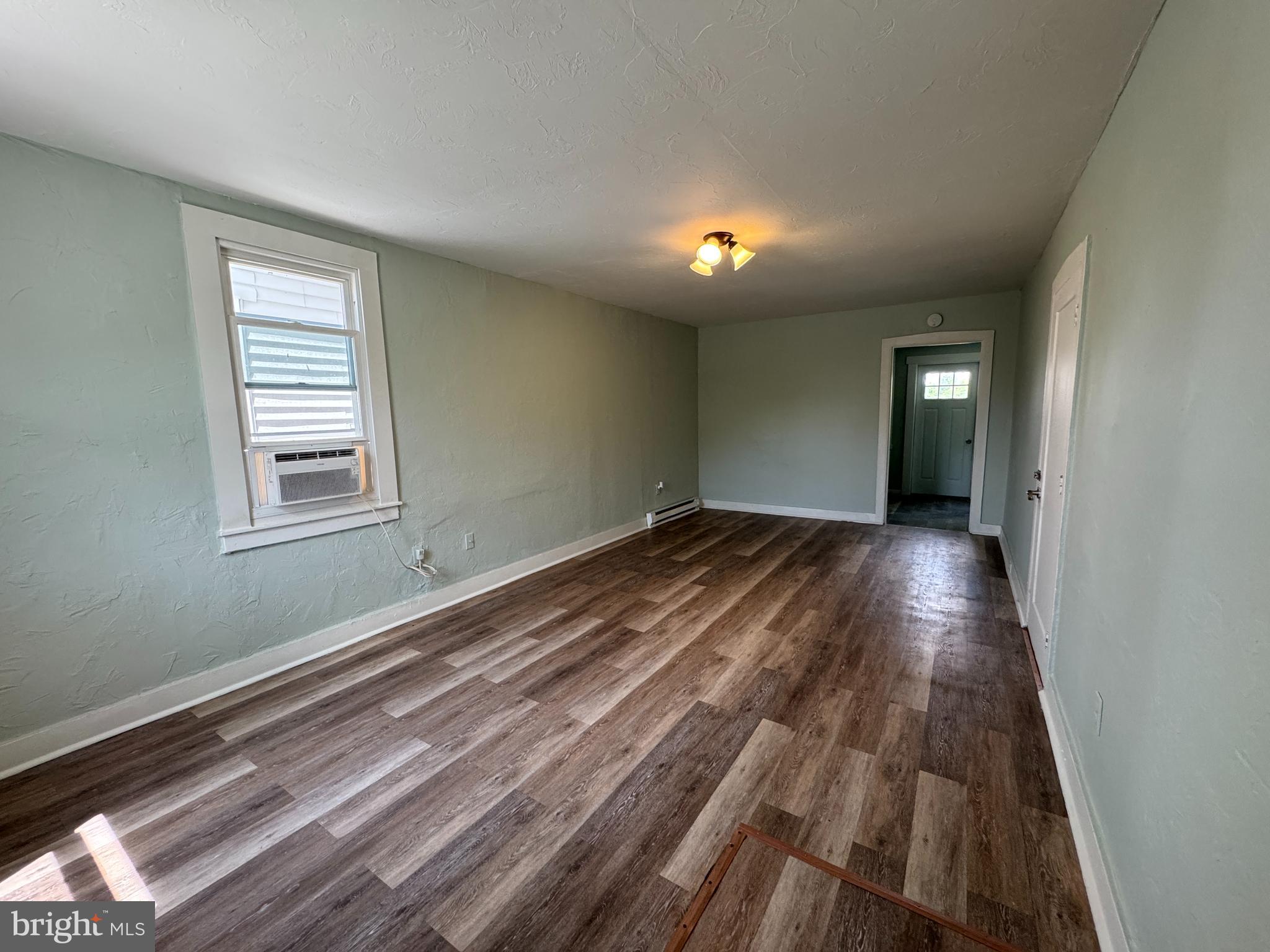 3754 Baltimore Pike, Unit 3 Littlestown, PA 17340 - Photo 6 of 21 a view of a room with wooden floor and window