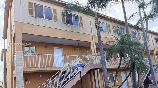 a view of a house with a wooden deck