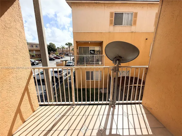 a balcony view with a sink
