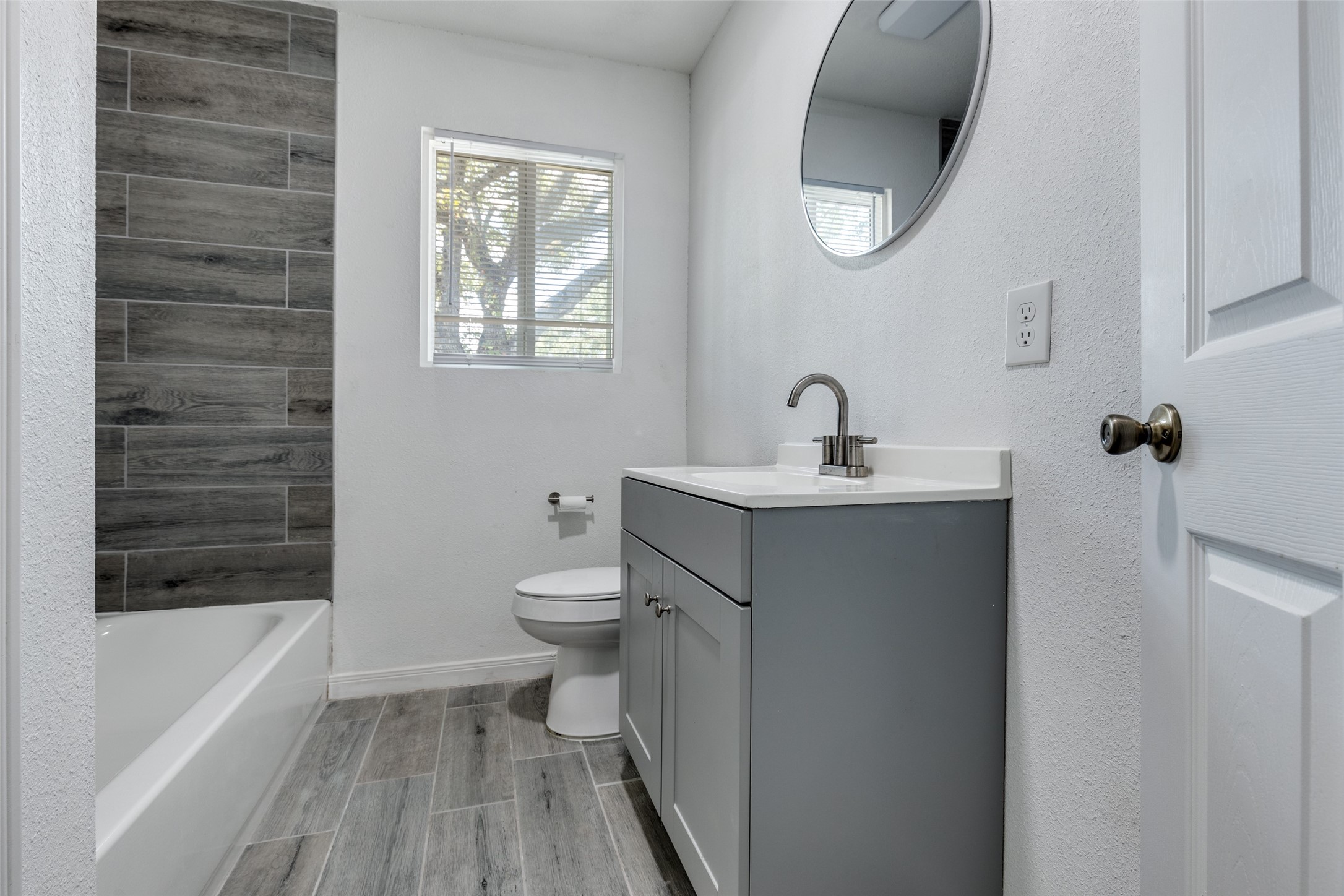 200 Pine Street Prairie View, TX 77446 - Photo 17 of 25 a bathroom with a sink a toilet and bathtub
