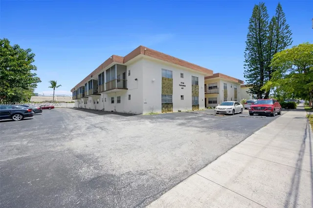 a view of car parked in front of house