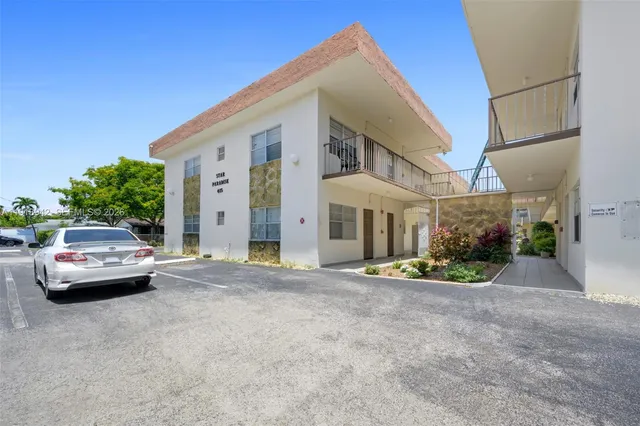 a view of street with parked cars