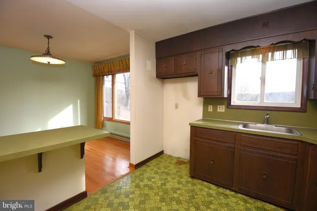 a kitchen with a sink and a window