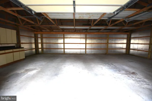 a view of a large kitchen with a sink and dishwasher