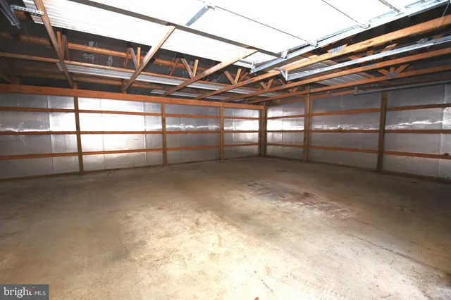 a big yard with lots of green space and trees