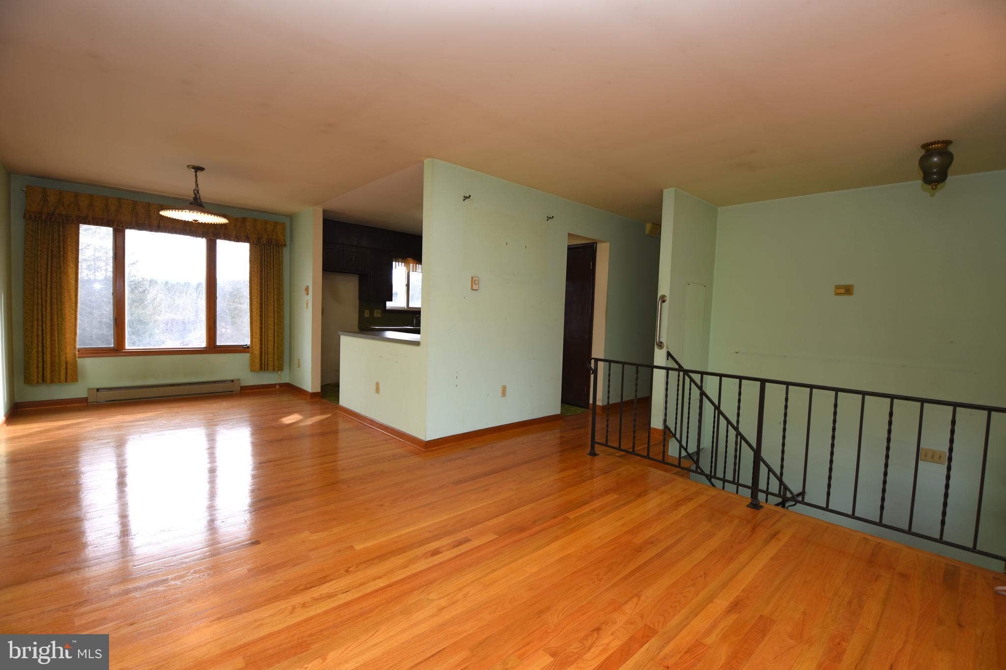 3288 Slifer Valley Road Riegelsville, PA 18077 - Photo 7 of 36 a view of an empty room with wooden floor and a window