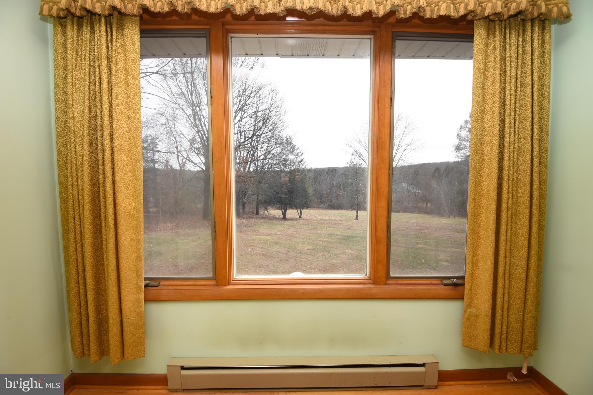 3288 Slifer Valley Road Riegelsville, PA 18077 - Photo 8 of 36 a view of a glass door with a from a window