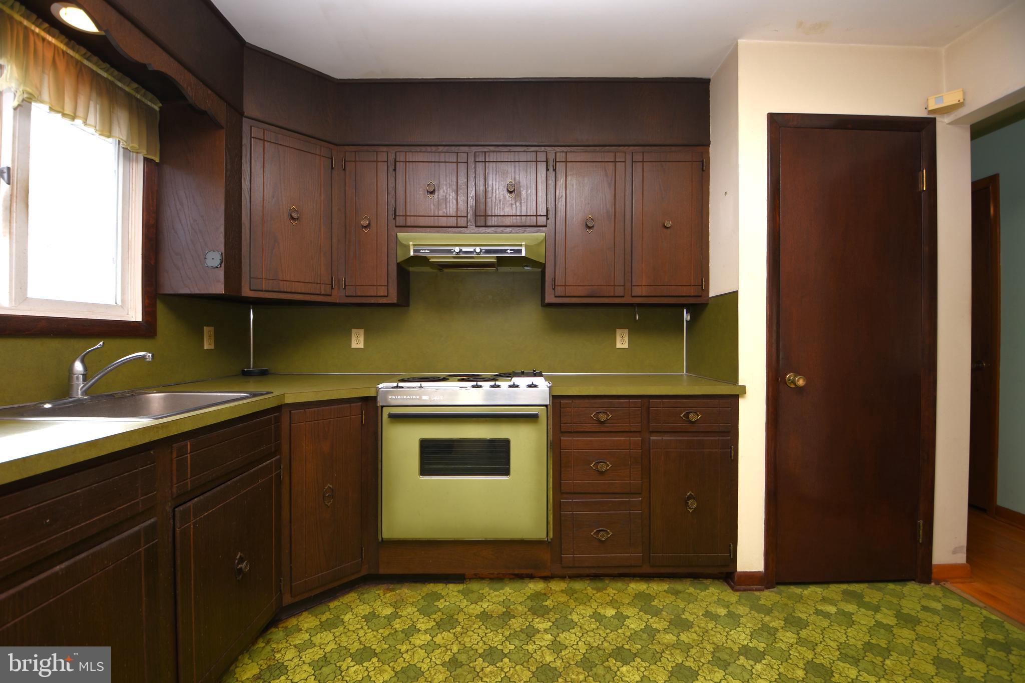 3288 Slifer Valley Road Riegelsville, PA 18077 - Photo 10 of 36 a kitchen with stainless steel appliances granite countertop wooden cabinets and a sink