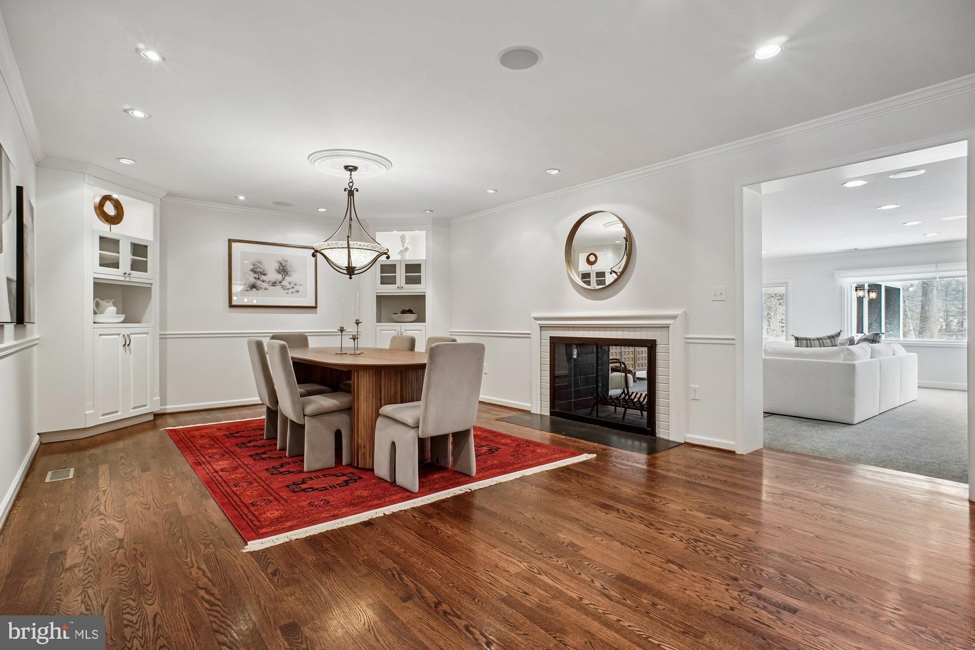 8512 Burning Tree Road Bethesda, MD 20817 - Photo 10 of 78 Dining Room with double sided fireplace