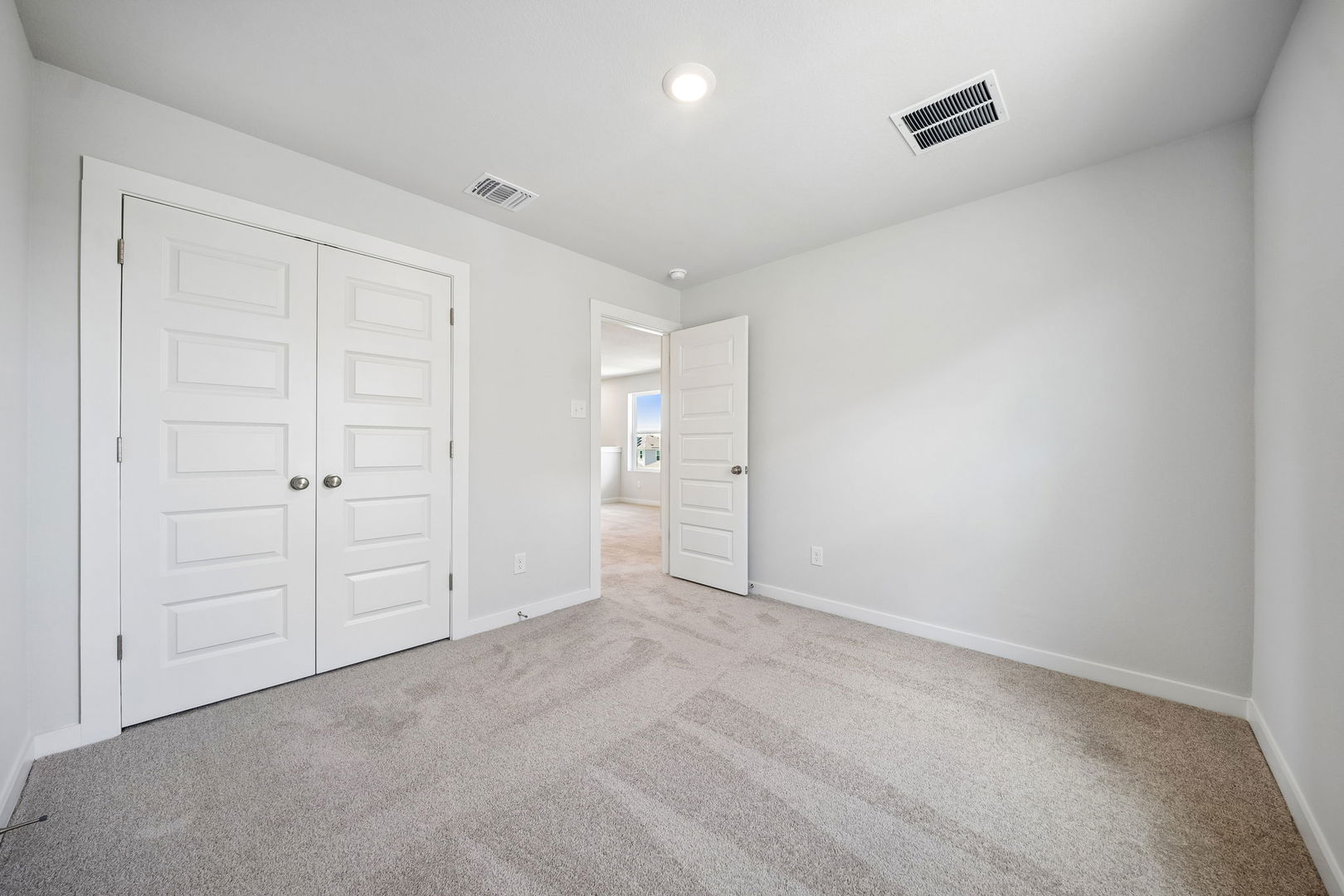 145 Hornet Street Elgin, TX 78621 - Photo 7 of 18 A spacious room offers comfortable carpeting, ready for personalization.
