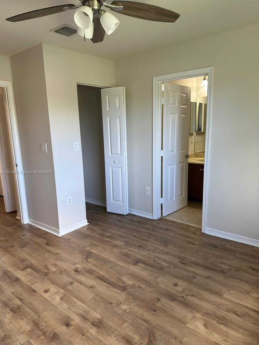 9113 Chambers Street Tamarac, FL 33321 - Photo 2 of 13 a view of a room with wooden floor and table and chairs