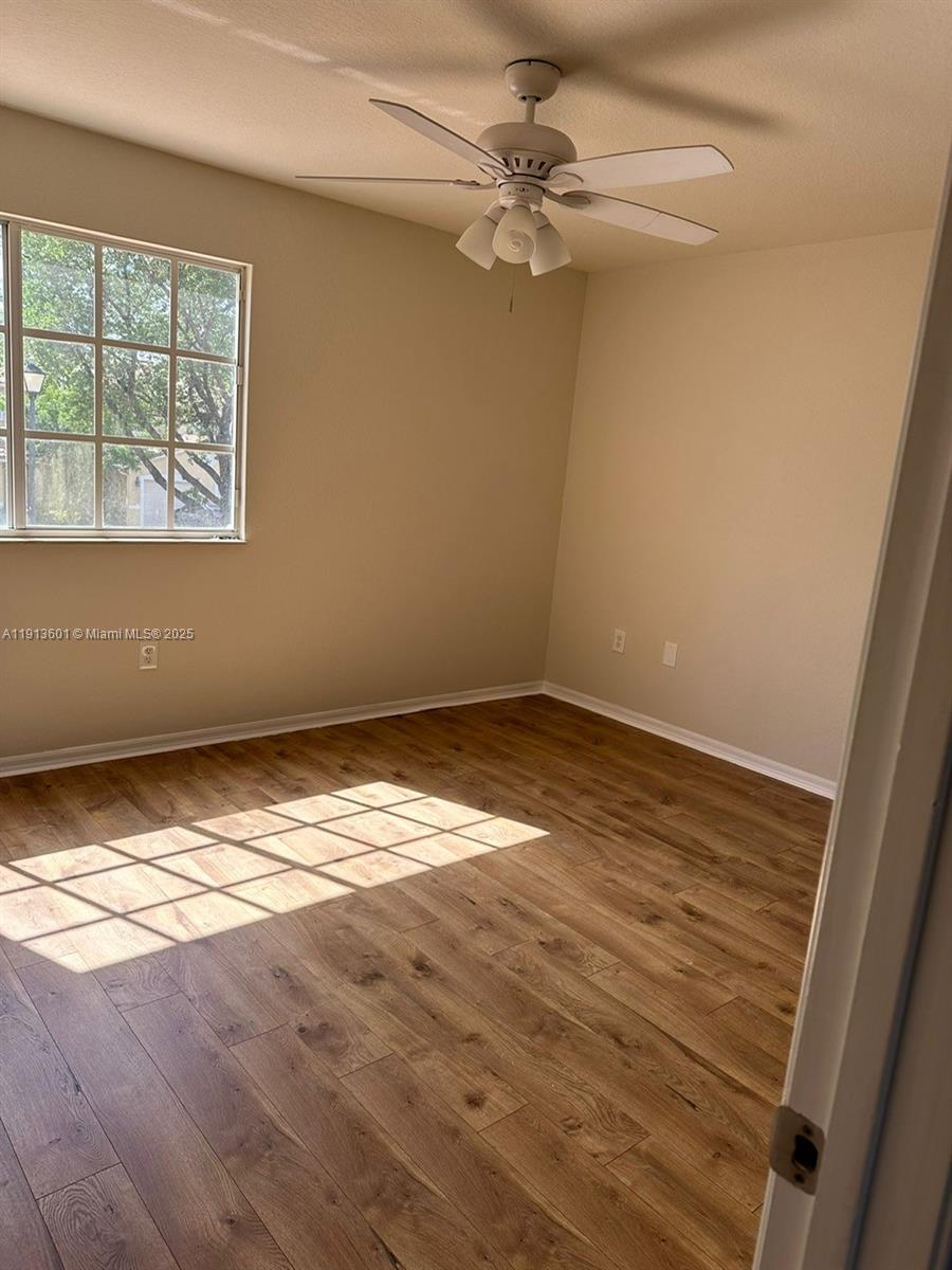 9113 Chambers Street Tamarac, FL 33321 - Photo 8 of 13 a view of empty room with wooden floor