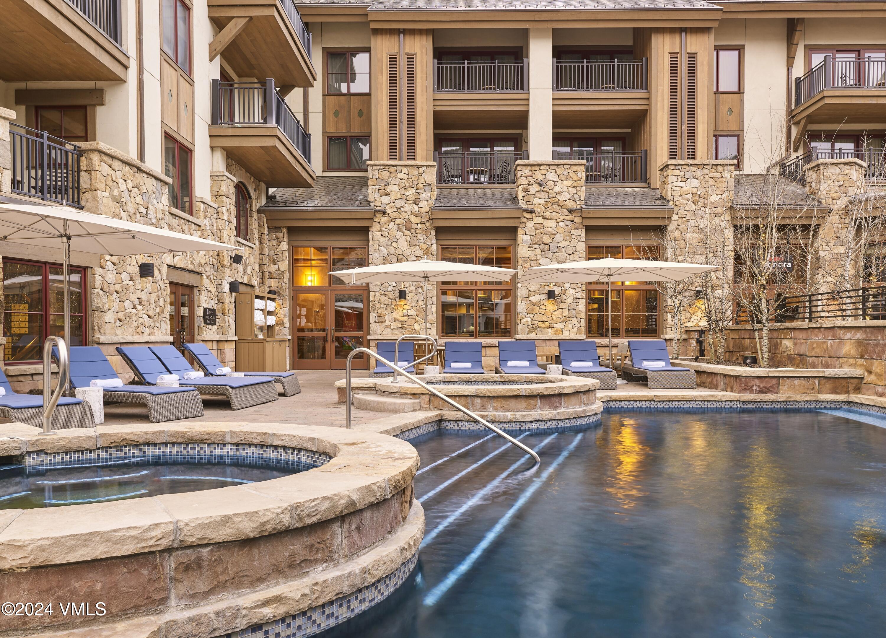 16 Vail Road, Unit 223 Vail, CO 81657 - Photo 5 of 5 a view of a swimming pool with building exterior