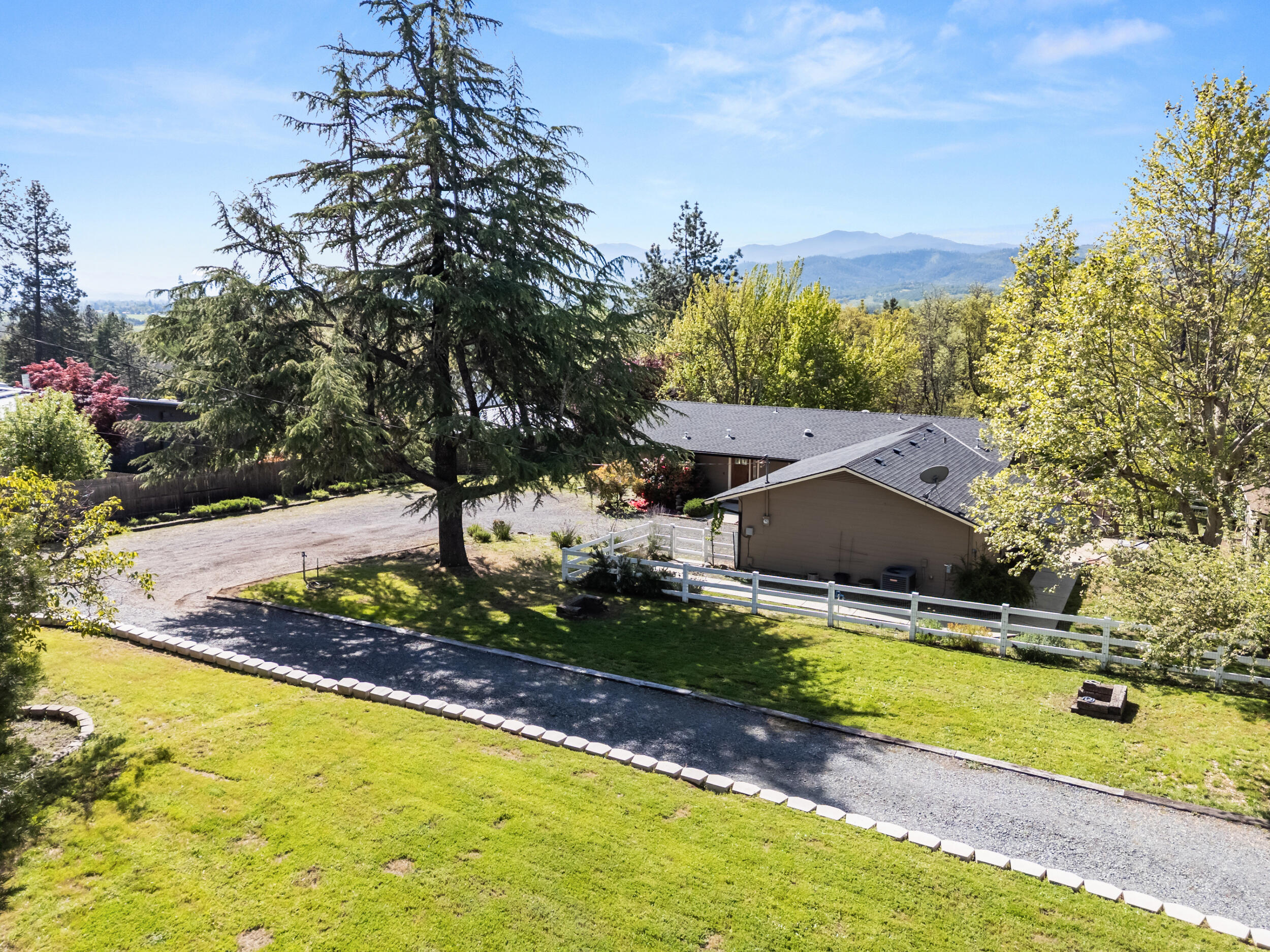 3583 Ross Lane Central Point, OR 97502 - Photo 34 of 52 a view of a house with swimming pool and yard