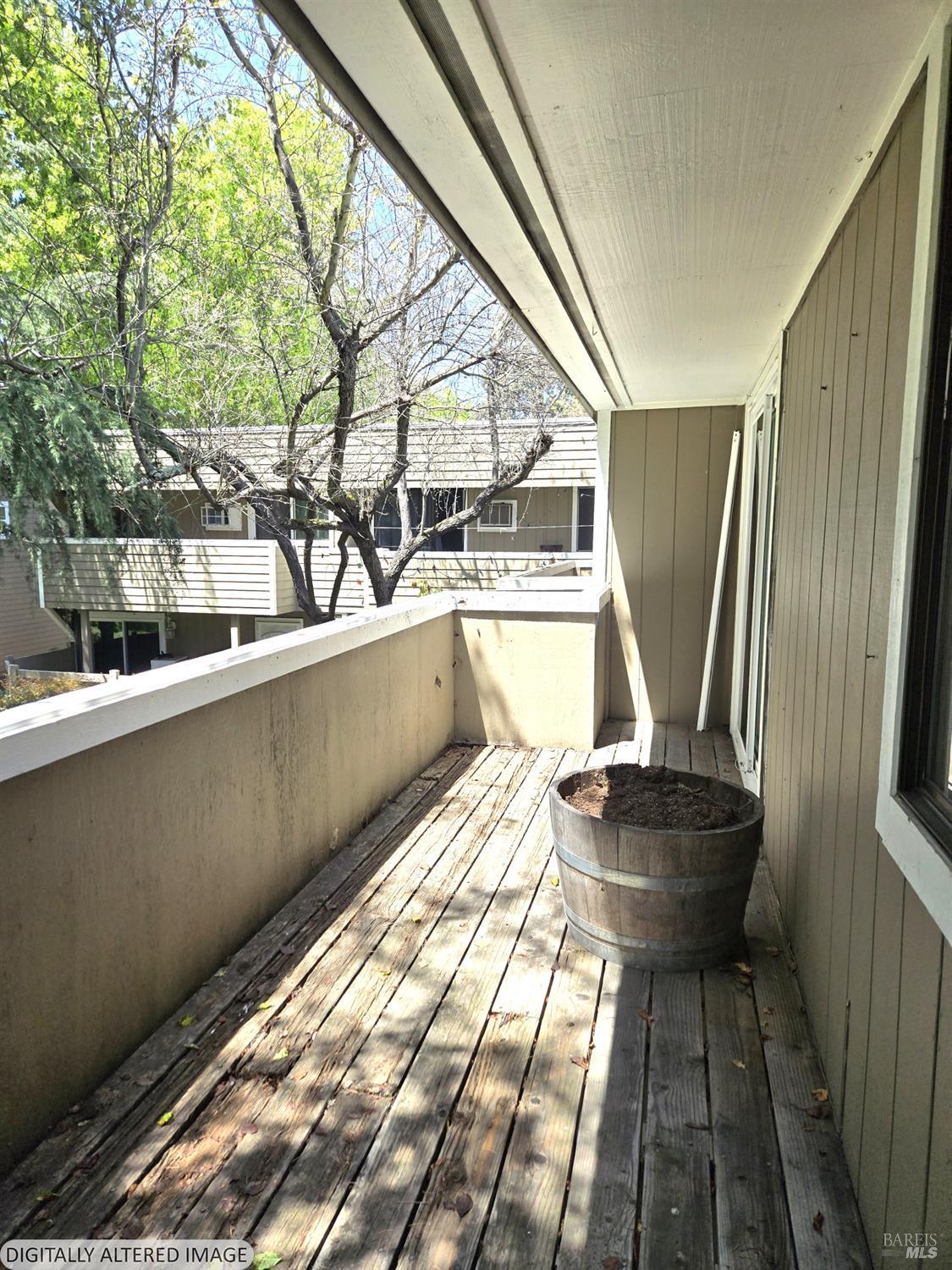 2125 West Steele Lane Santa Rosa, CA 95403 - Photo 14 of 16 a room with wooden floor and furniture