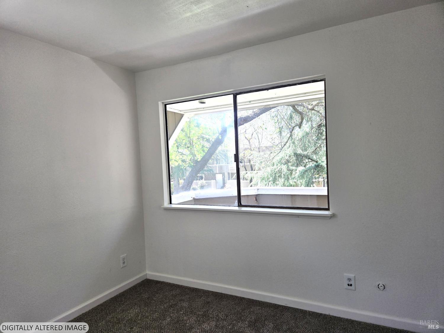 2125 West Steele Lane Santa Rosa, CA 95403 - Photo 6 of 16 an empty room with a window