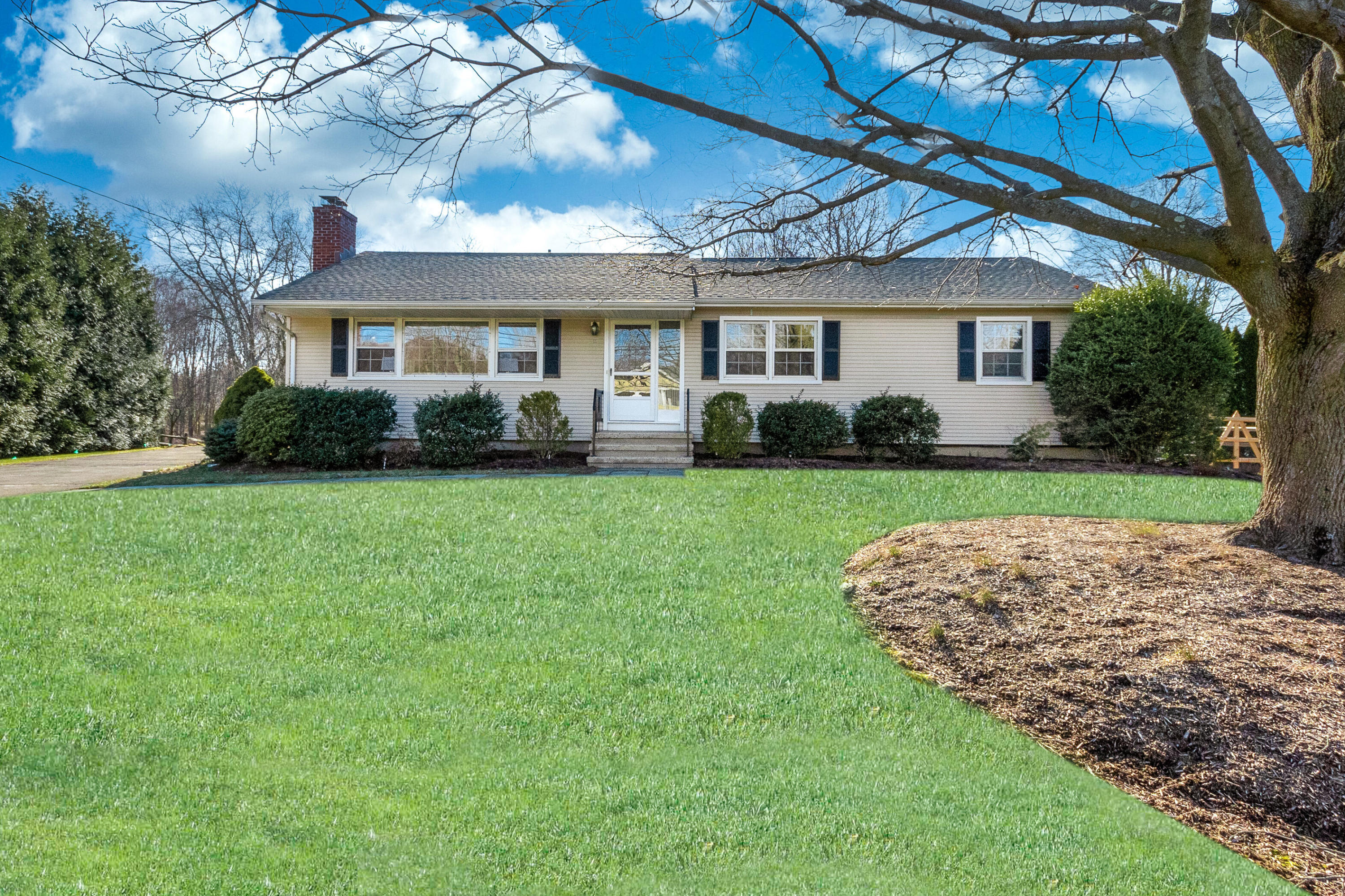 11 Cottontail Road Norwalk, CT 06854 - Photo 2 of 51 a front view of a house with a garden and yard