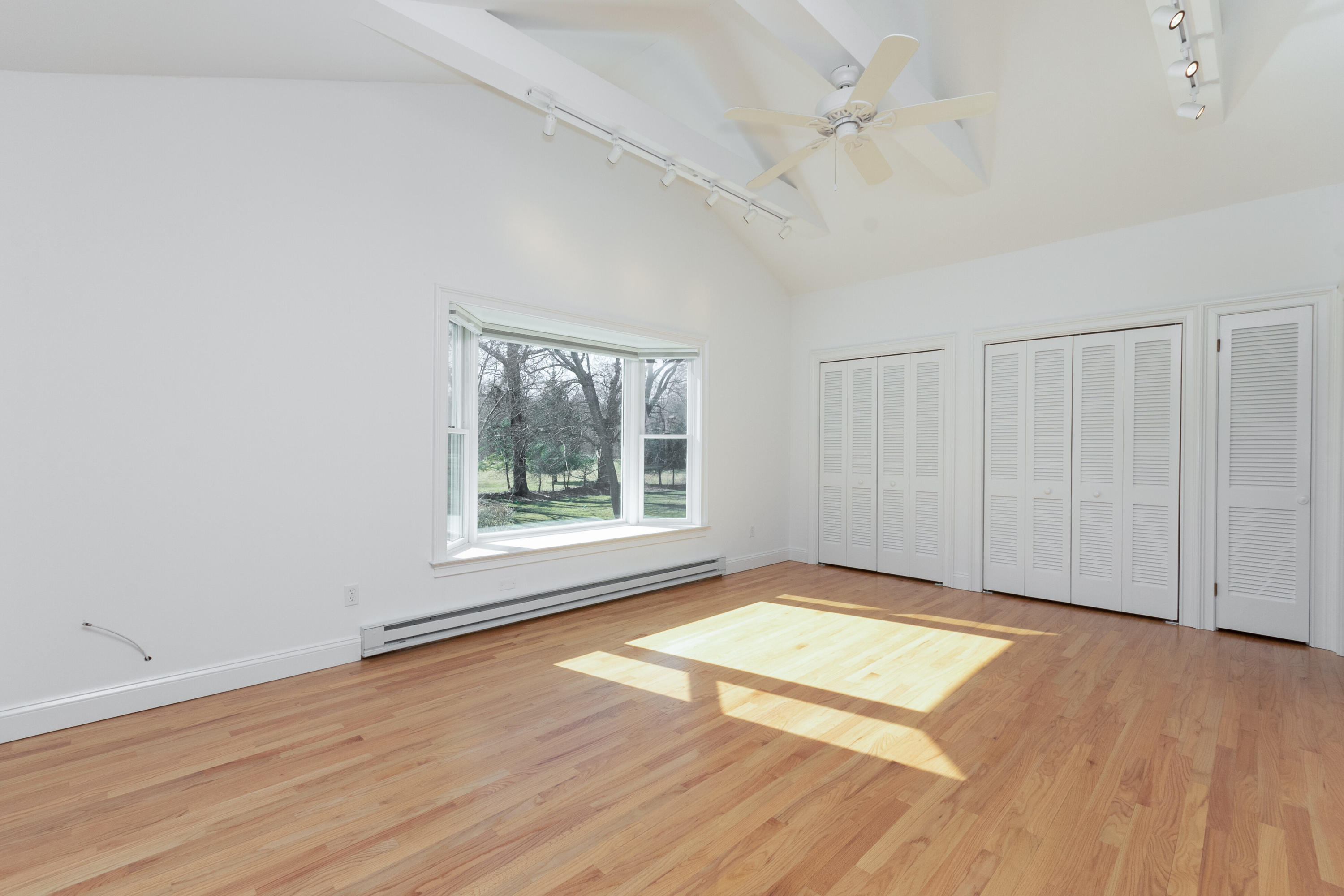 11 Cottontail Road Norwalk, CT 06854 - Photo 24 of 51 an empty room with wooden floor and windows