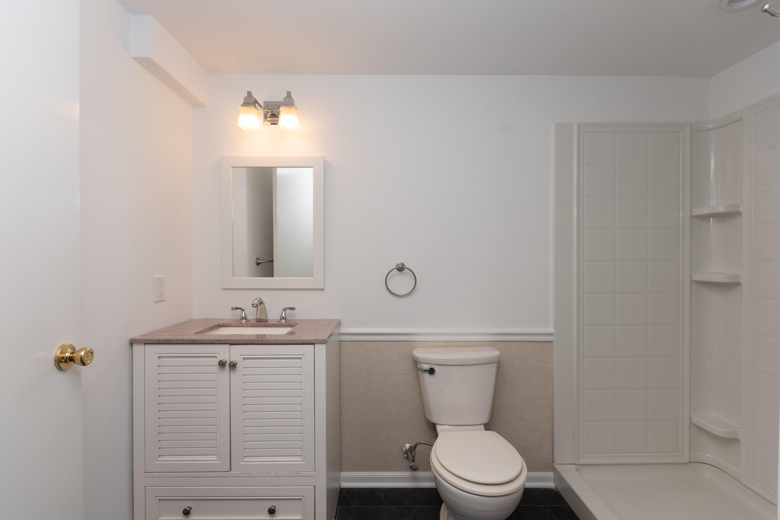 11 Cottontail Road Norwalk, CT 06854 - Photo 38 of 51 a bathroom with a toilet a sink and mirror