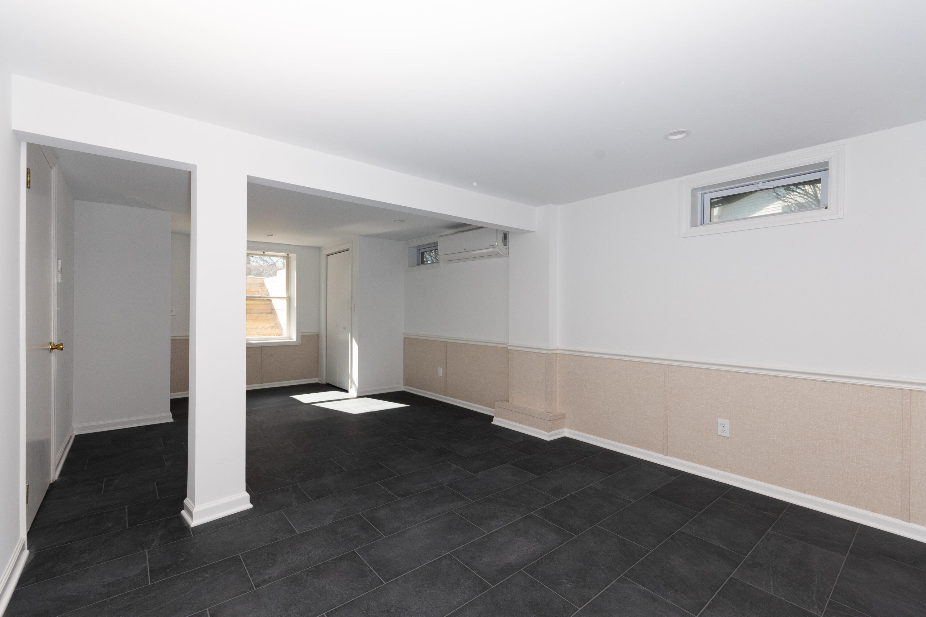 11 Cottontail Road Norwalk, CT 06854 - Photo 41 of 51 an empty room with wooden floor and windows