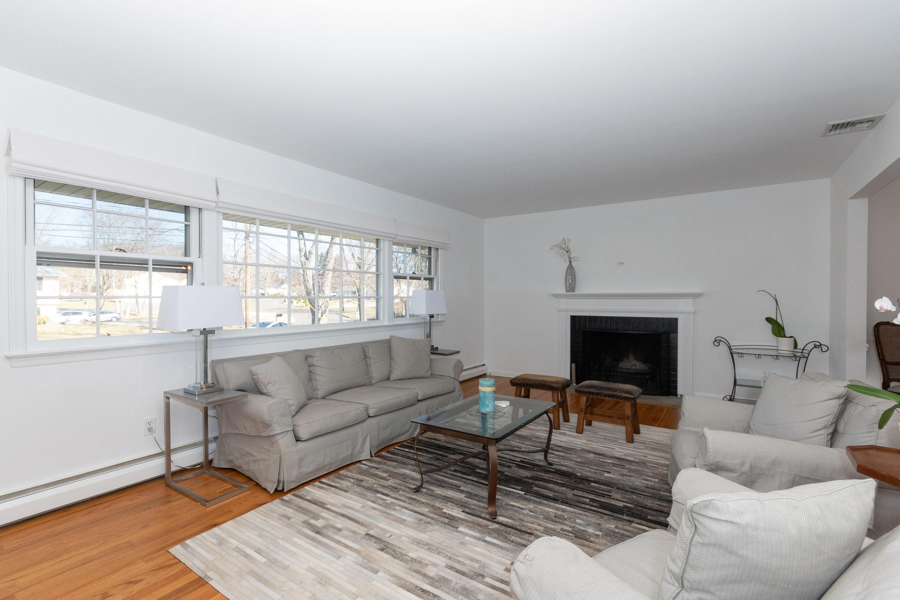11 Cottontail Road Norwalk, CT 06854 - Photo 7 of 51 a living room with furniture and a fireplace