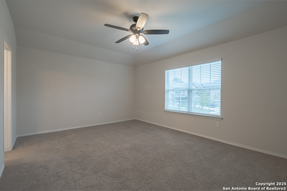 3934 Copper River Bulverde, TX 78163 - Photo 15 of 28 an empty room with a window and a fan