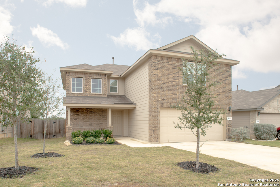 3934 Copper River Bulverde, TX 78163 - Photo 2 of 28 a front view of a house with a yard and garage
