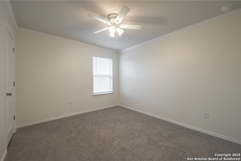 3934 Copper River Bulverde, TX 78163 - Photo 23 of 28 an empty room with a window and a ceiling fan