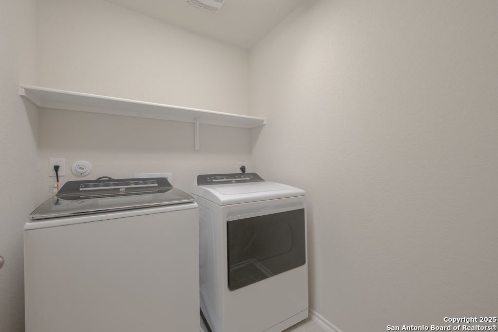 3934 Copper River Bulverde, TX 78163 - Photo 25 of 28 a utility room with dryer and washer
