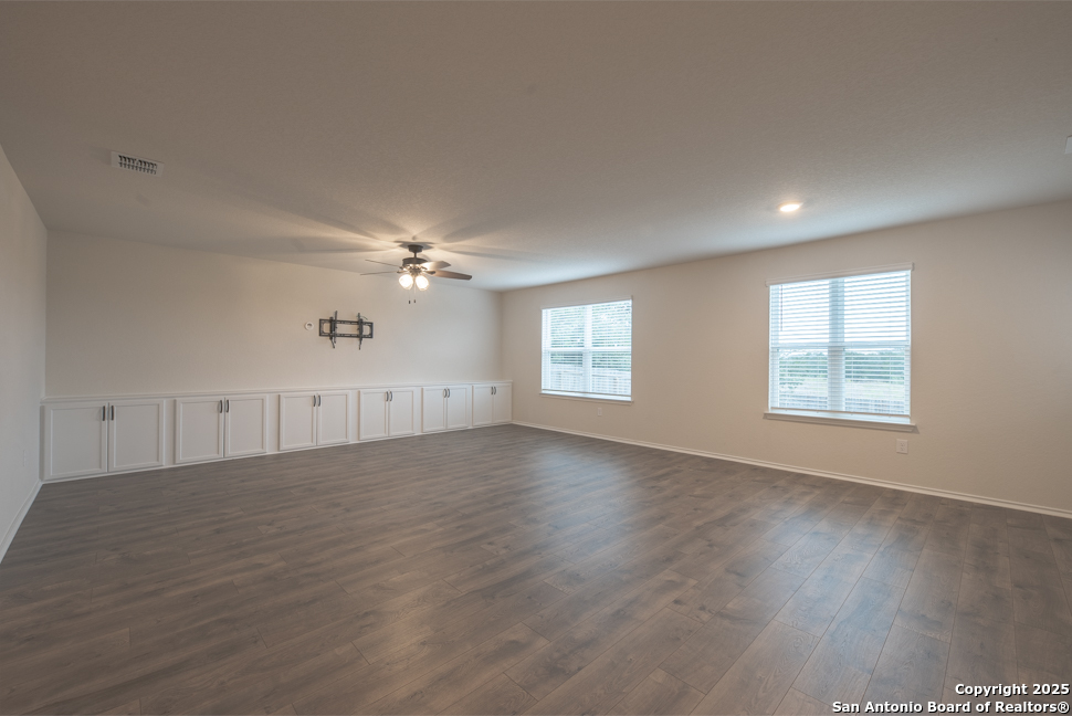 3934 Copper River Bulverde, TX 78163 - Photo 3 of 28 an empty room with wooden floor and windows