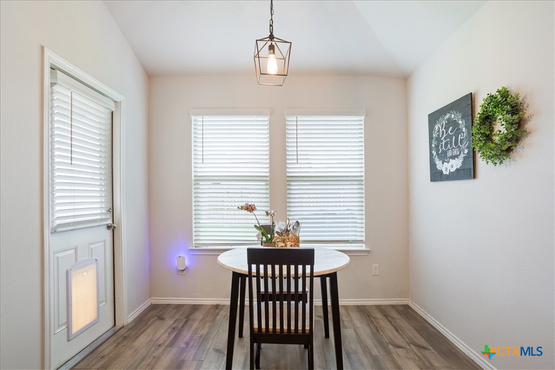 1000 Velvet Court Troy, TX 76579 - Photo 8 of 25 a view of a hallway with wooden floor and a window