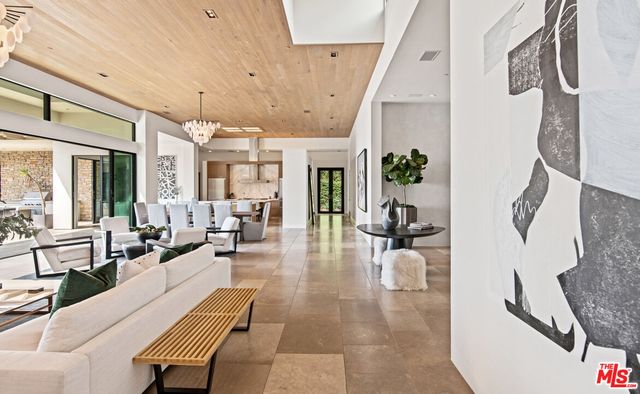 a bathroom with a granite countertop sink a toilet and mirror