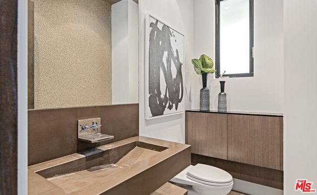 a living room with a couch and a flat screen tv