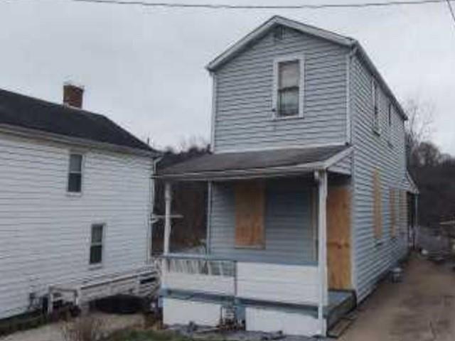 a front view of a house with garage
