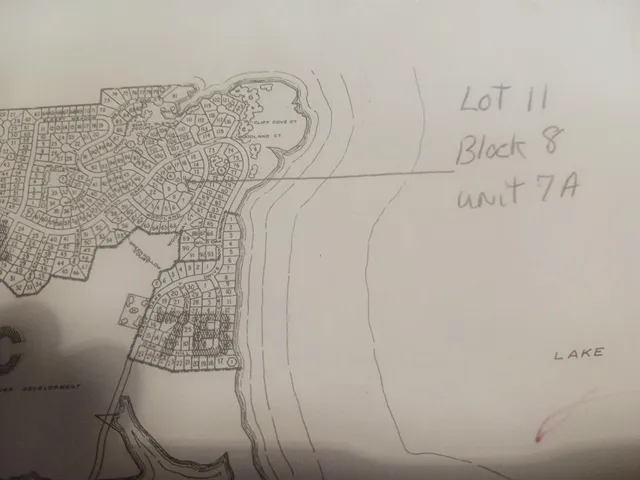 a bathroom with a toilet and shower