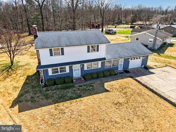 a aerial view of a house with swimming pool and patio