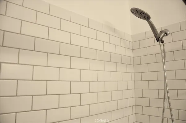 a view of an empty room with a fireplace and a fireplace