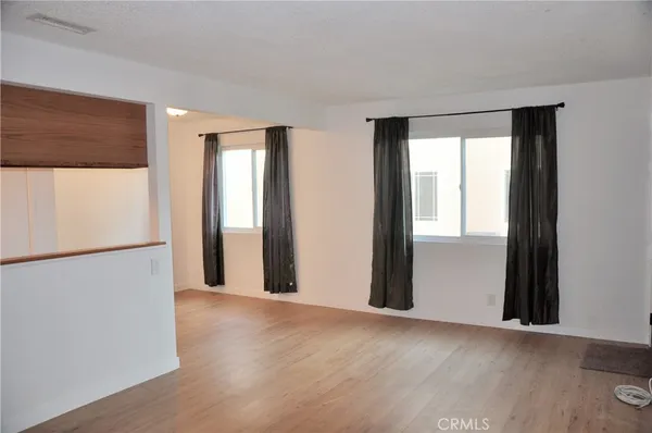 a view of a room with a large window