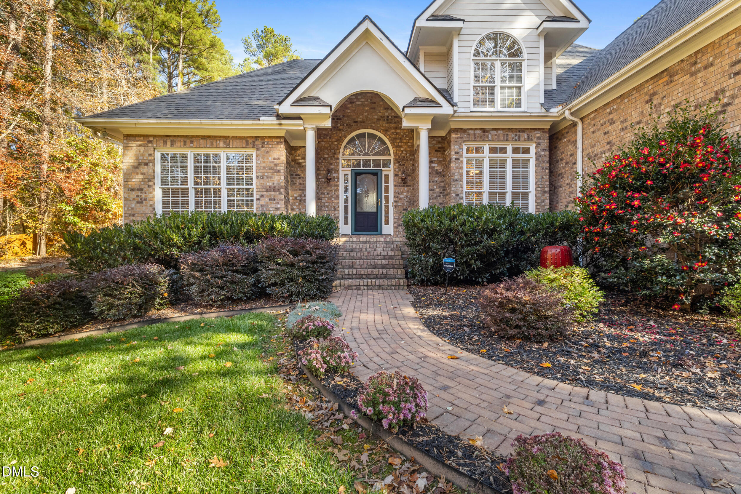 6816 Cool Pond Road Raleigh, NC 27613 - Photo 2 of 65 a front view of a house with a yard