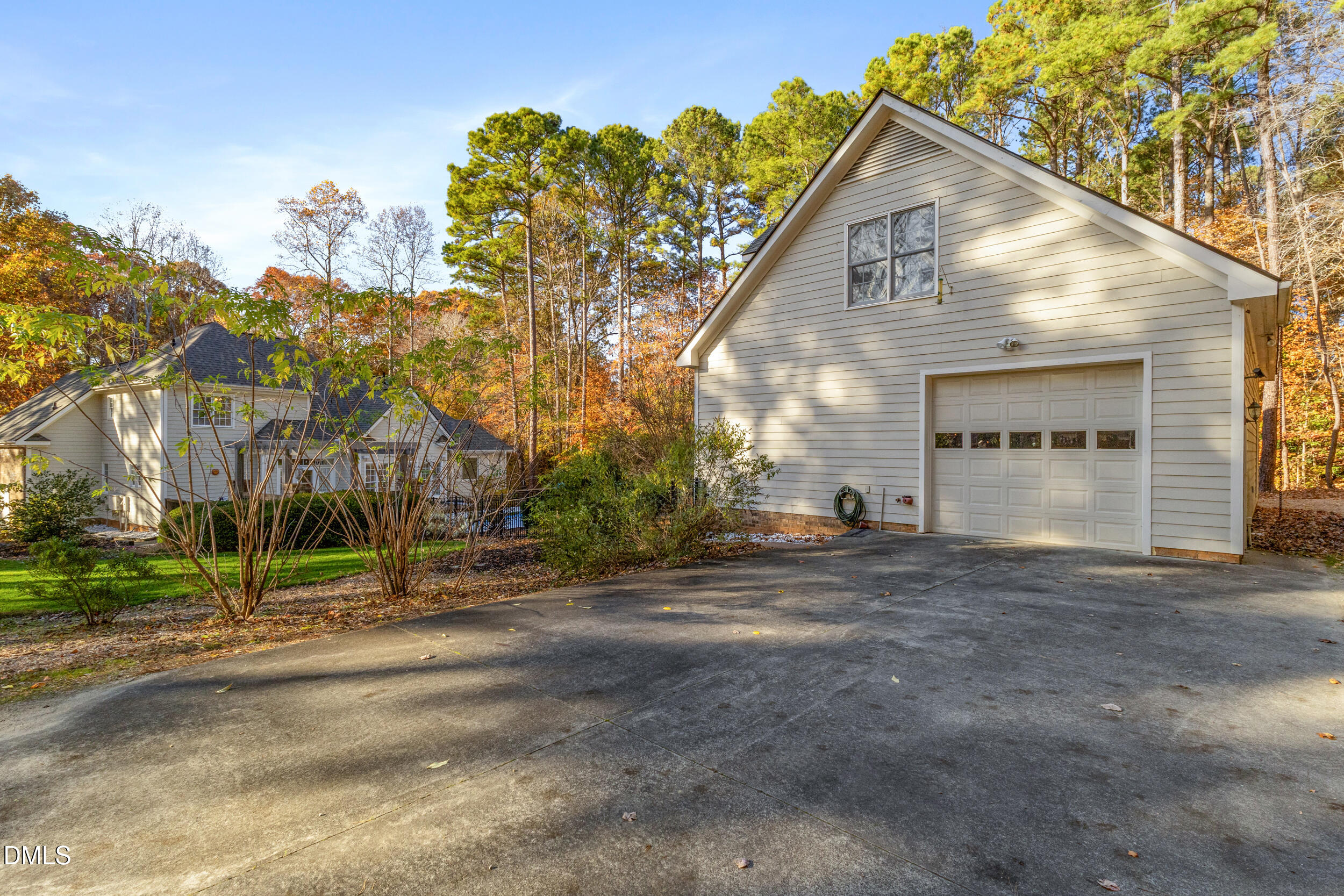 6816 Cool Pond Road Raleigh, NC 27613 - Photo 43 of 65 a view of a house with a yard and garage