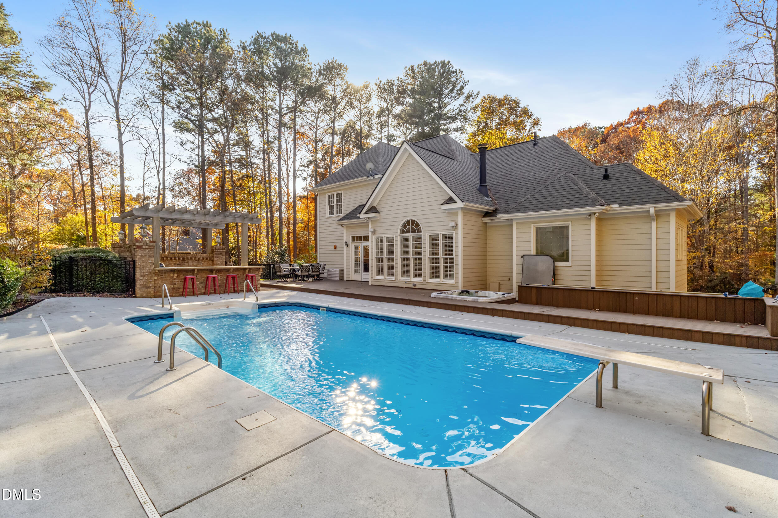 6816 Cool Pond Road Raleigh, NC 27613 - Photo 52 of 65 a view of a house with swimming pool and sitting area