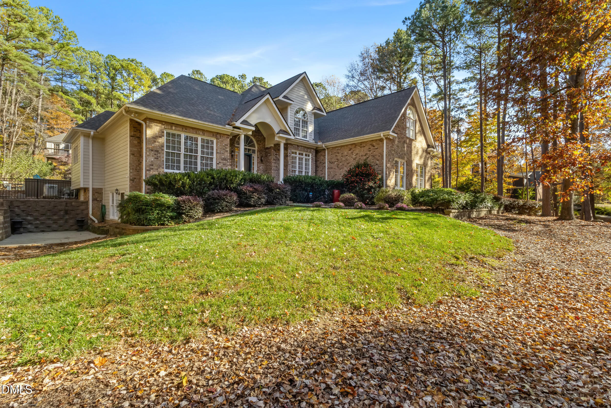6816 Cool Pond Road Raleigh, NC 27613 - Photo 6 of 65 a front view of a house with a yard