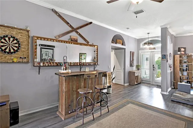 a view of a room with furniture and wooden floor