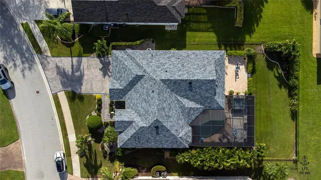 an aerial view of multiple houses with yard