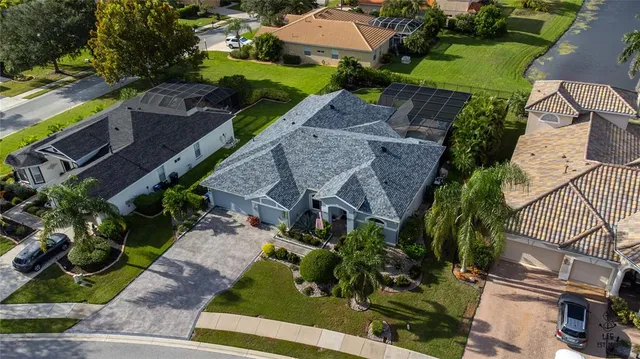 an aerial view of house with a yard